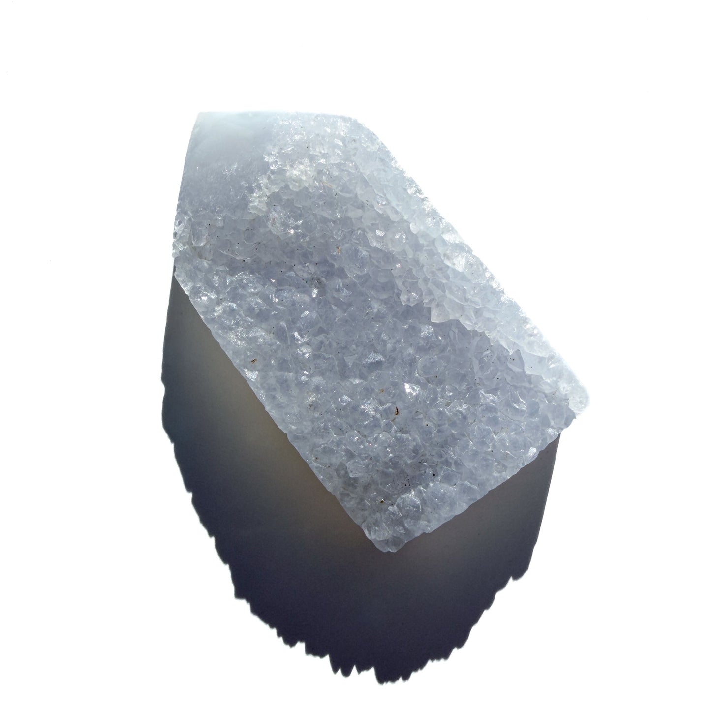 blue chalcedony crystal tower on a white background with shadow.