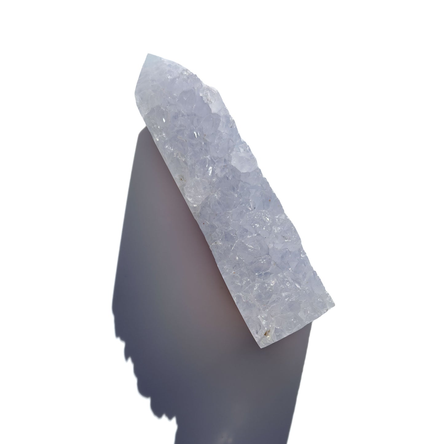 blue chalcedony crystal tower on a white background with shadow.